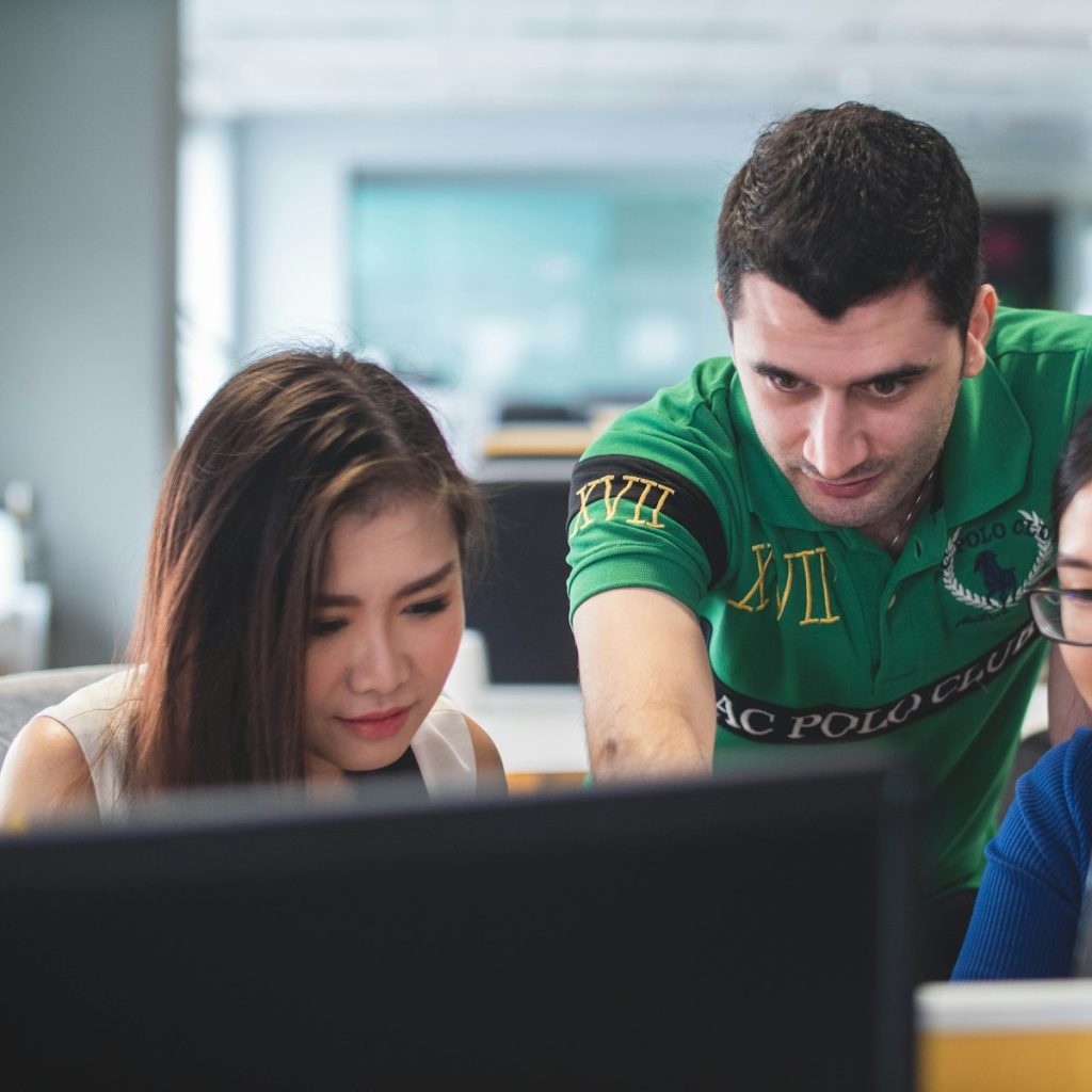 two women and one man on computer screen